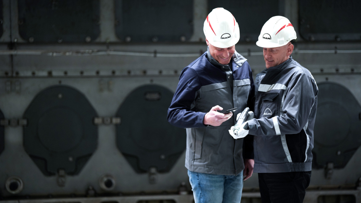 service engineers scanning tracking number with smartphone