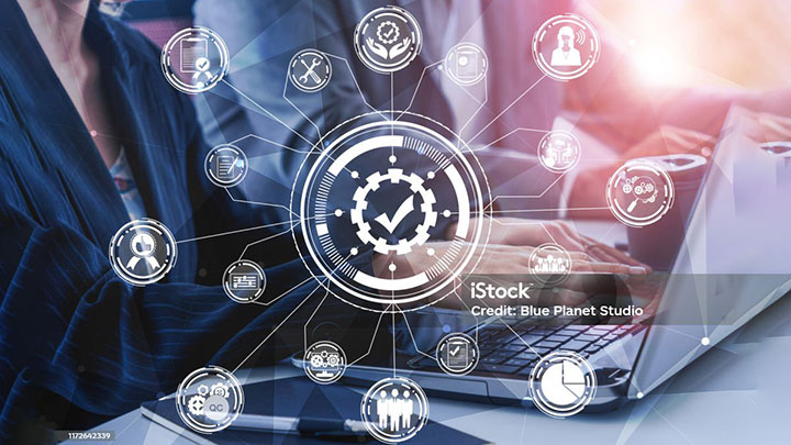 graphic overlay quality icons on laptop close up