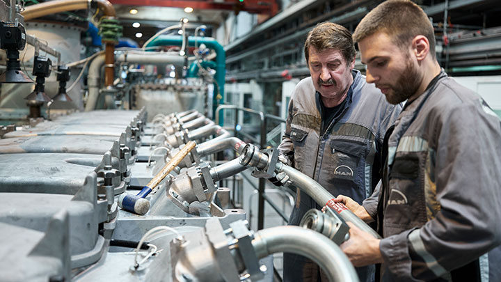 Engineers from MAN working on the four-stroke methanol test engine
