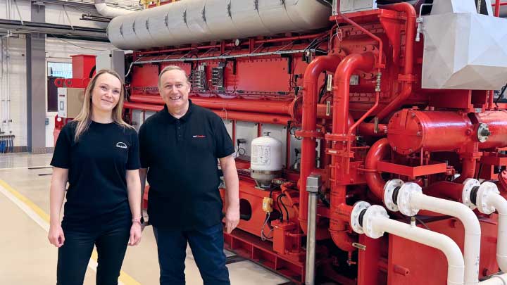 Image-stress-free two people in front of read MAN marine engine