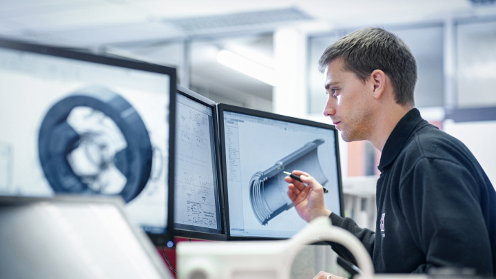 Man looking at spare parts on a computer screen